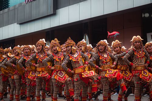 Free Colorful performers in traditional costumes celebrate Cebu's Sinulog Festival with lively dance. Stock Photo