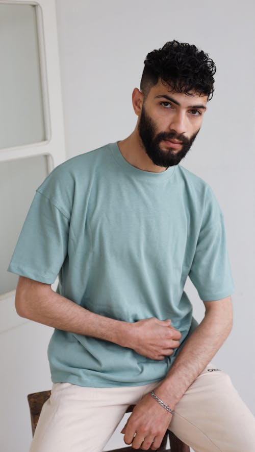 Studio Shot of a Bearded Man Wearing a Blue T-shirt 