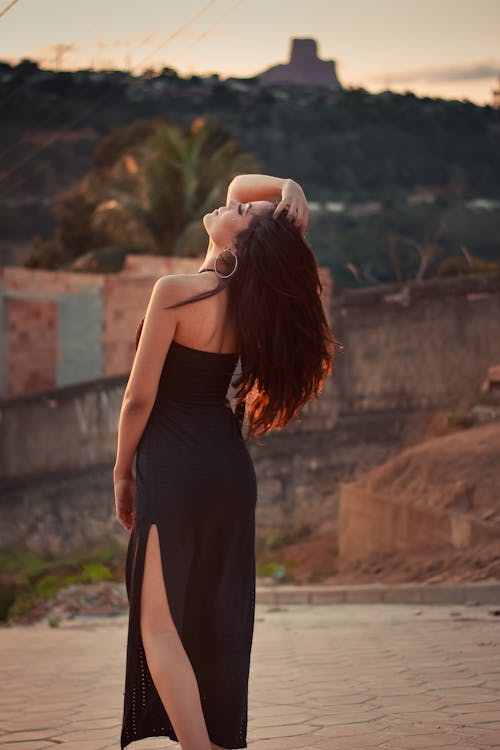 Model Posing in Black Dress