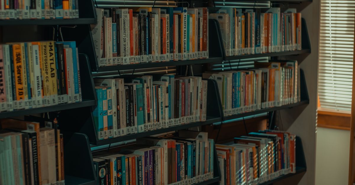 Books Ib Library Books on Shelves in Library · Free Stock Photo