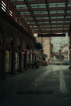 Discover a cozy street view under a glass ceiling in Bursa's urban setting.