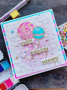 A vibrant birthday card with lollipop motifs and cheerful 'sweet birthday wishes!' message.