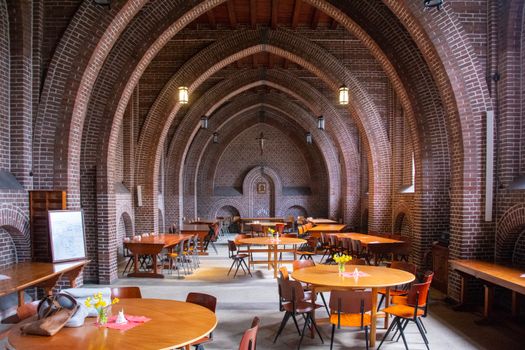 A large room with tables and chairs in it