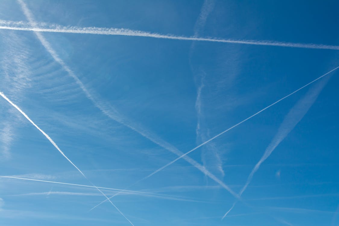 Contrails on Blue Sky · Free Stock Photo