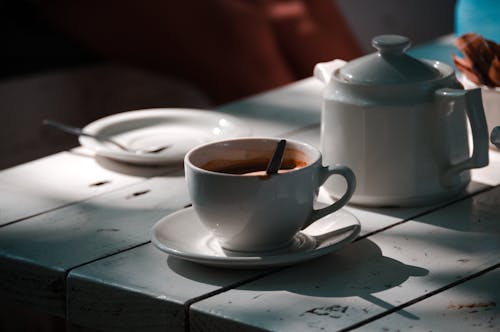 Free A Cup of Coffee and a Pot on the Table  Stock Photo