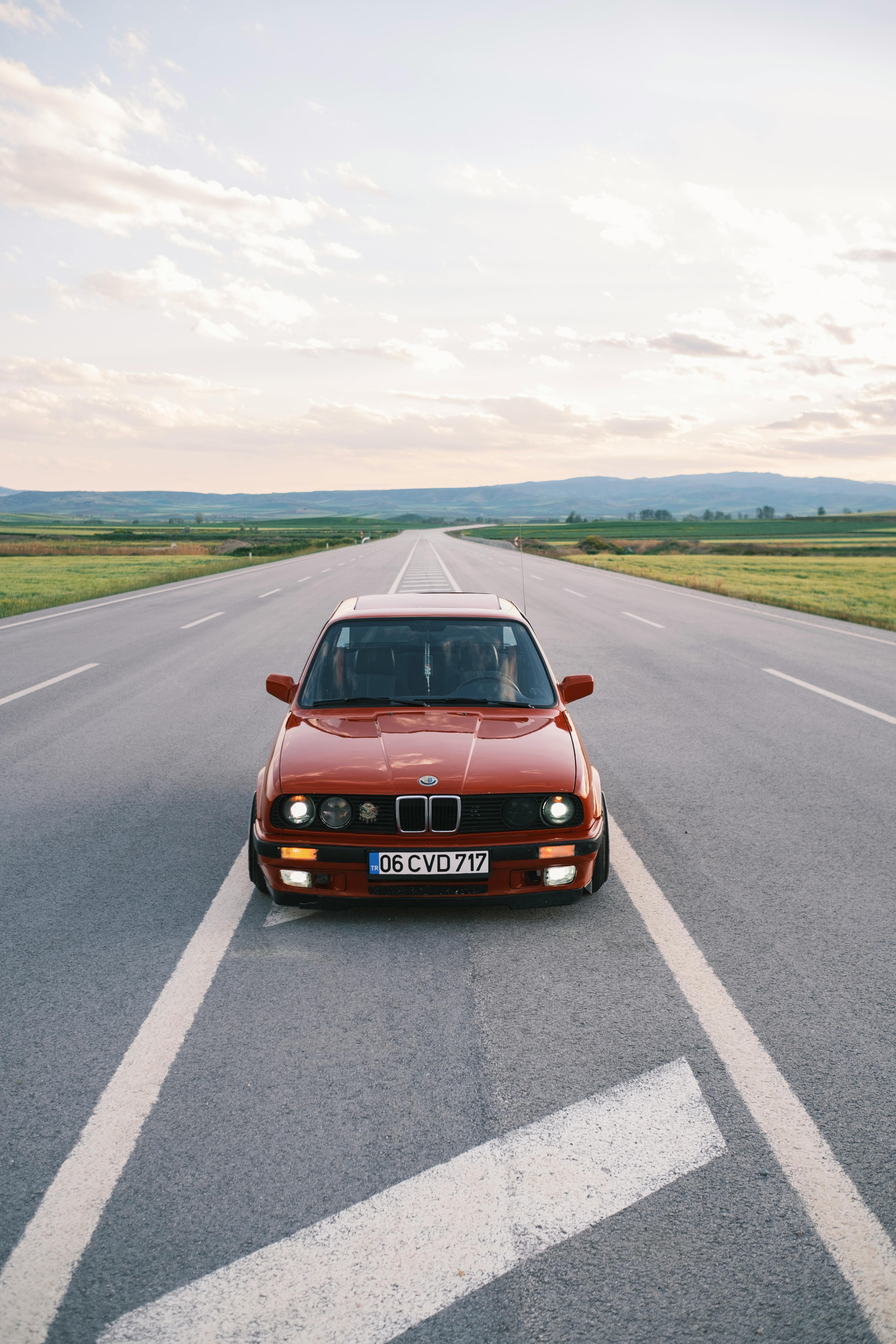 red bmw on empty road