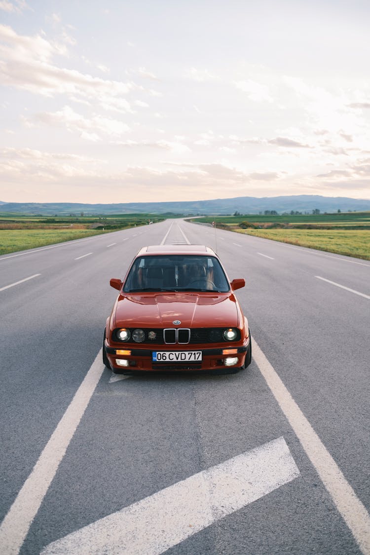 Red BMW On Empty Road