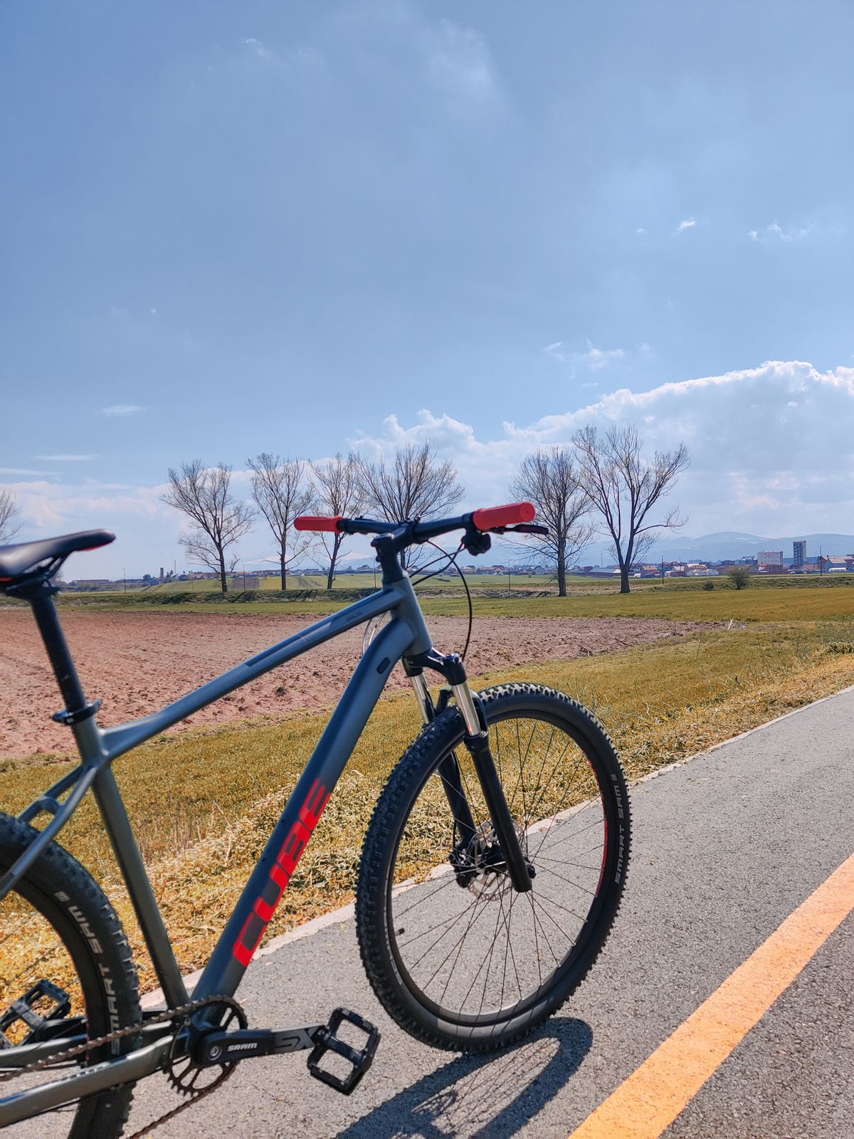 Bicycle on a paved road in a natural landscape