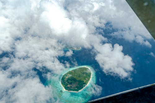 Aerial View of Island Hidden behind Clouds