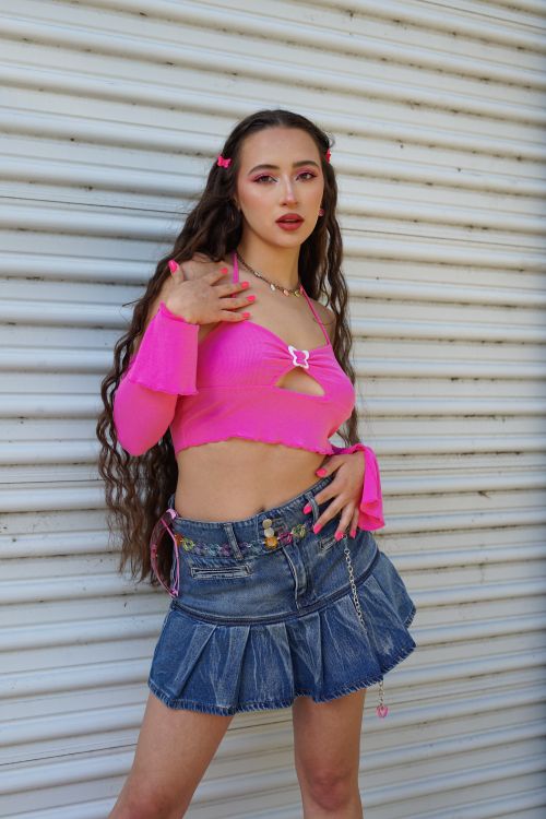 Young Woman Posing in a Pink Crop Top and Denim Skirt · Free Stock Photo