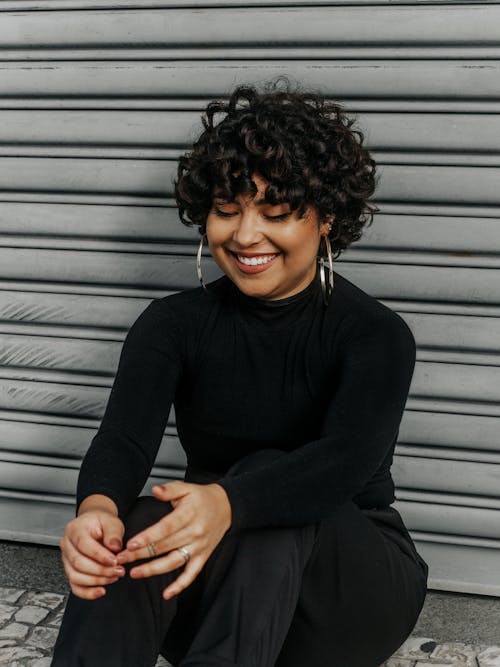 Smiling Woman Sitting and Posing