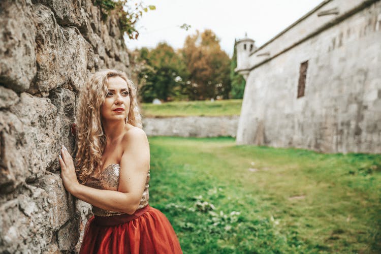 Blonde Woman In Dress In Village