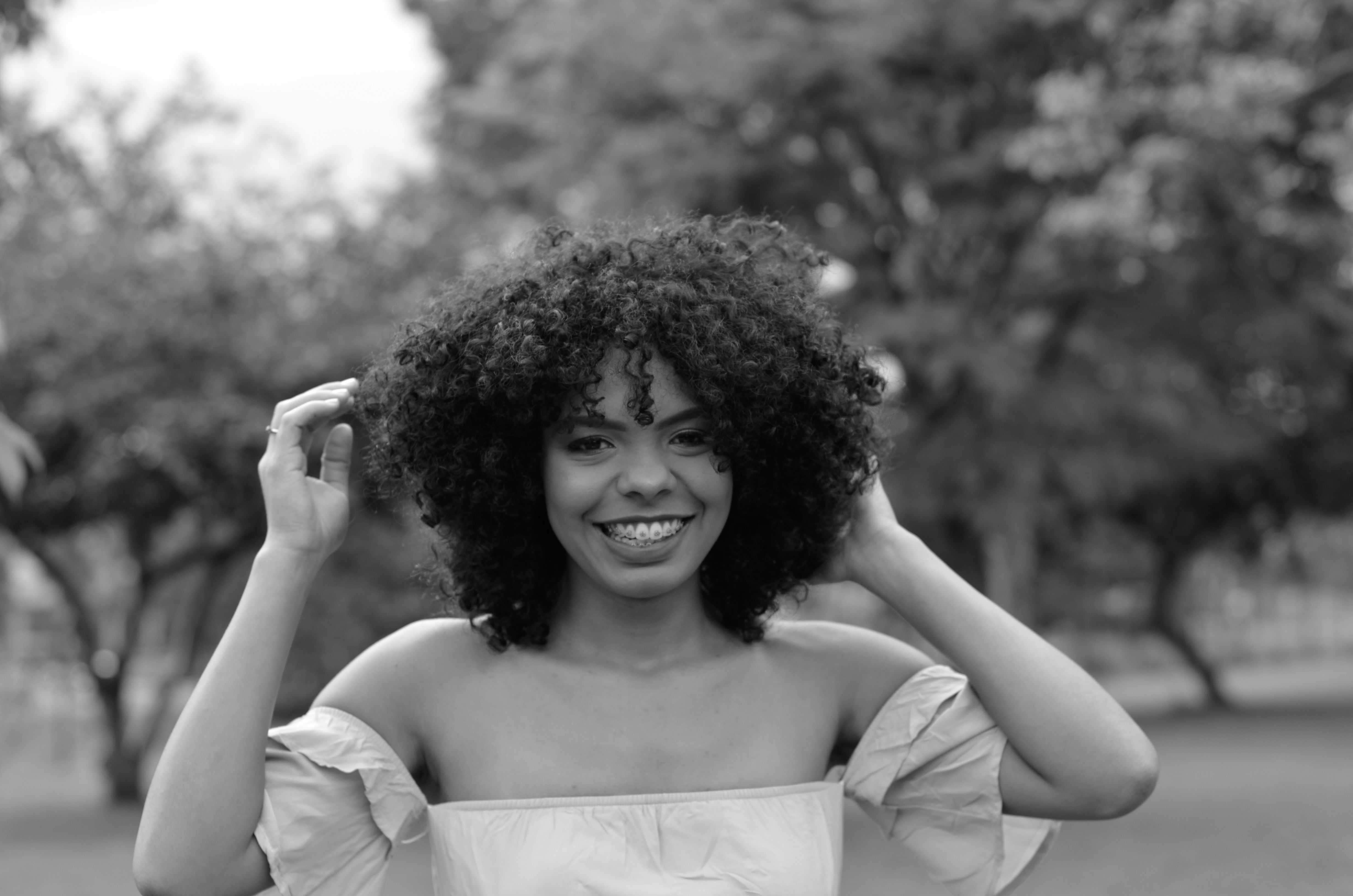 Smiling Woman Posing in Orchard · Free Stock Photo