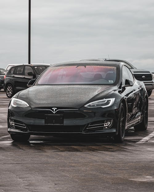 View of a Black Tesla Model S on a Parking Lot 