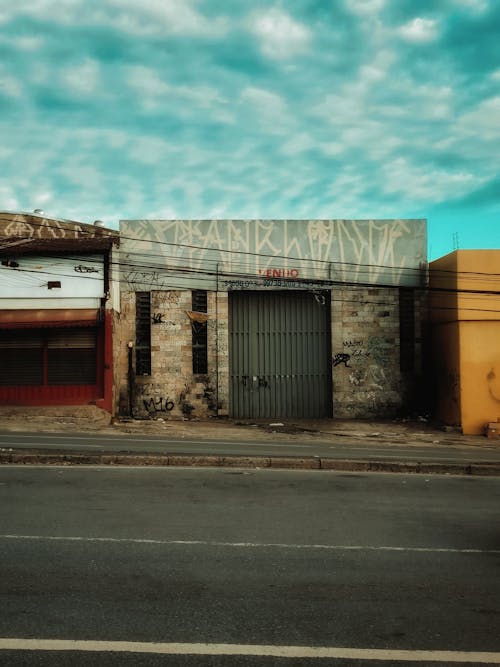 Street with Garages and a Cloudy Turquoise Sky