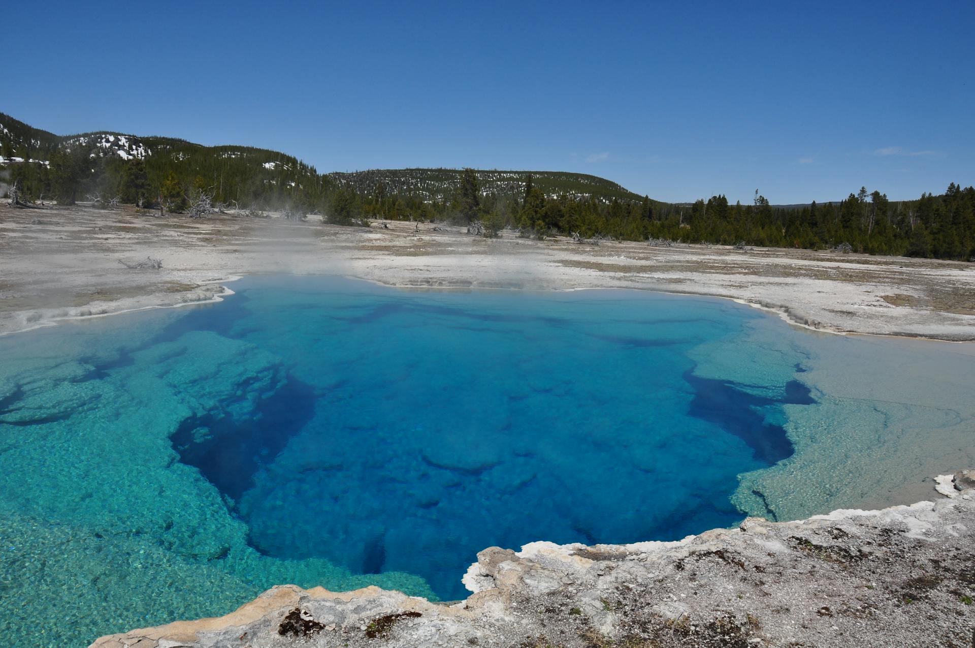 Majestic view of Sapphire Pool in Yellowstone's vibrant geothermal landscape.