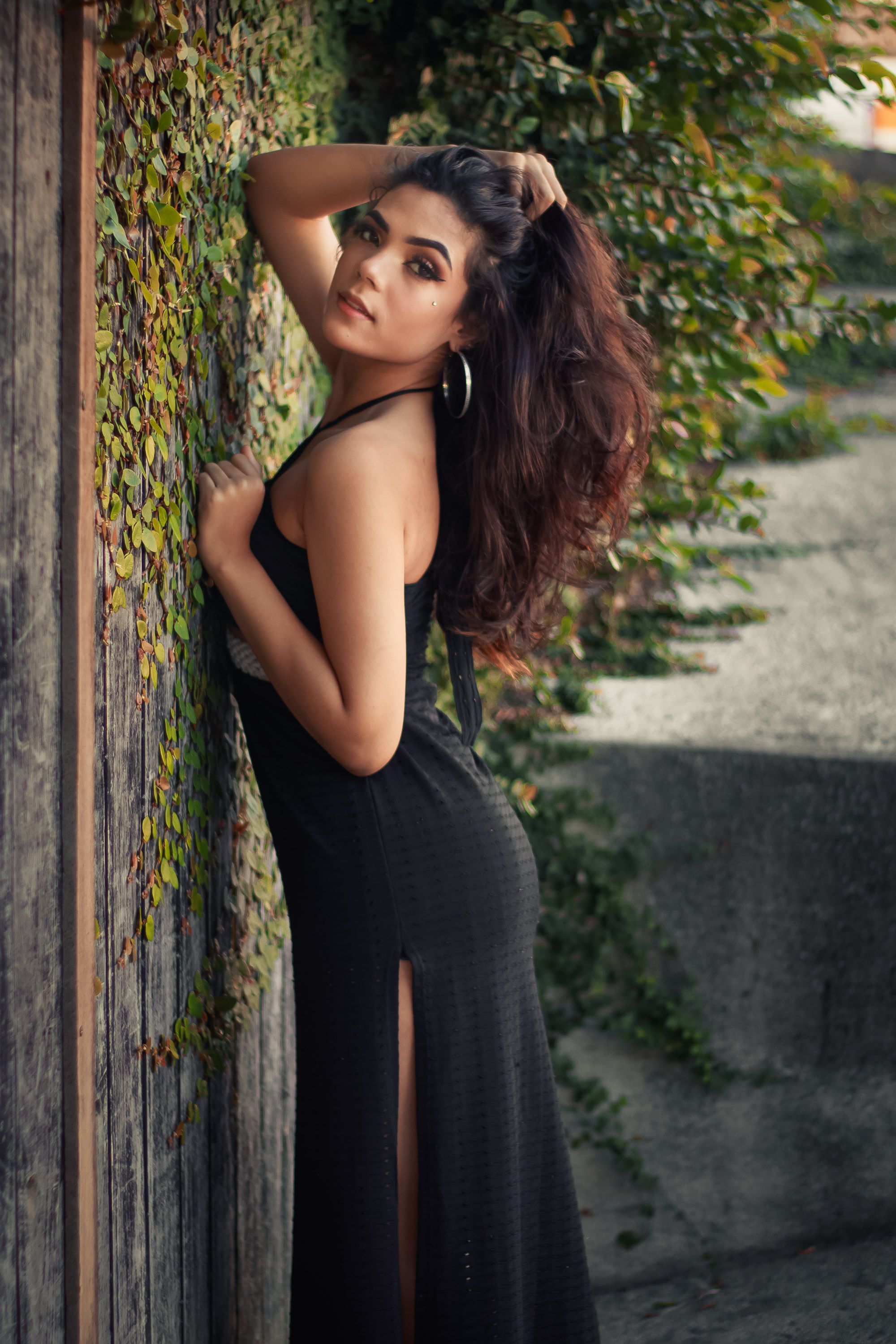 A Woman in Black Dress Posing Outdoor · Free Stock Photo