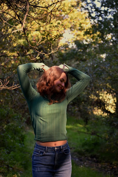 Woman in Green Long Sleeved Blouse