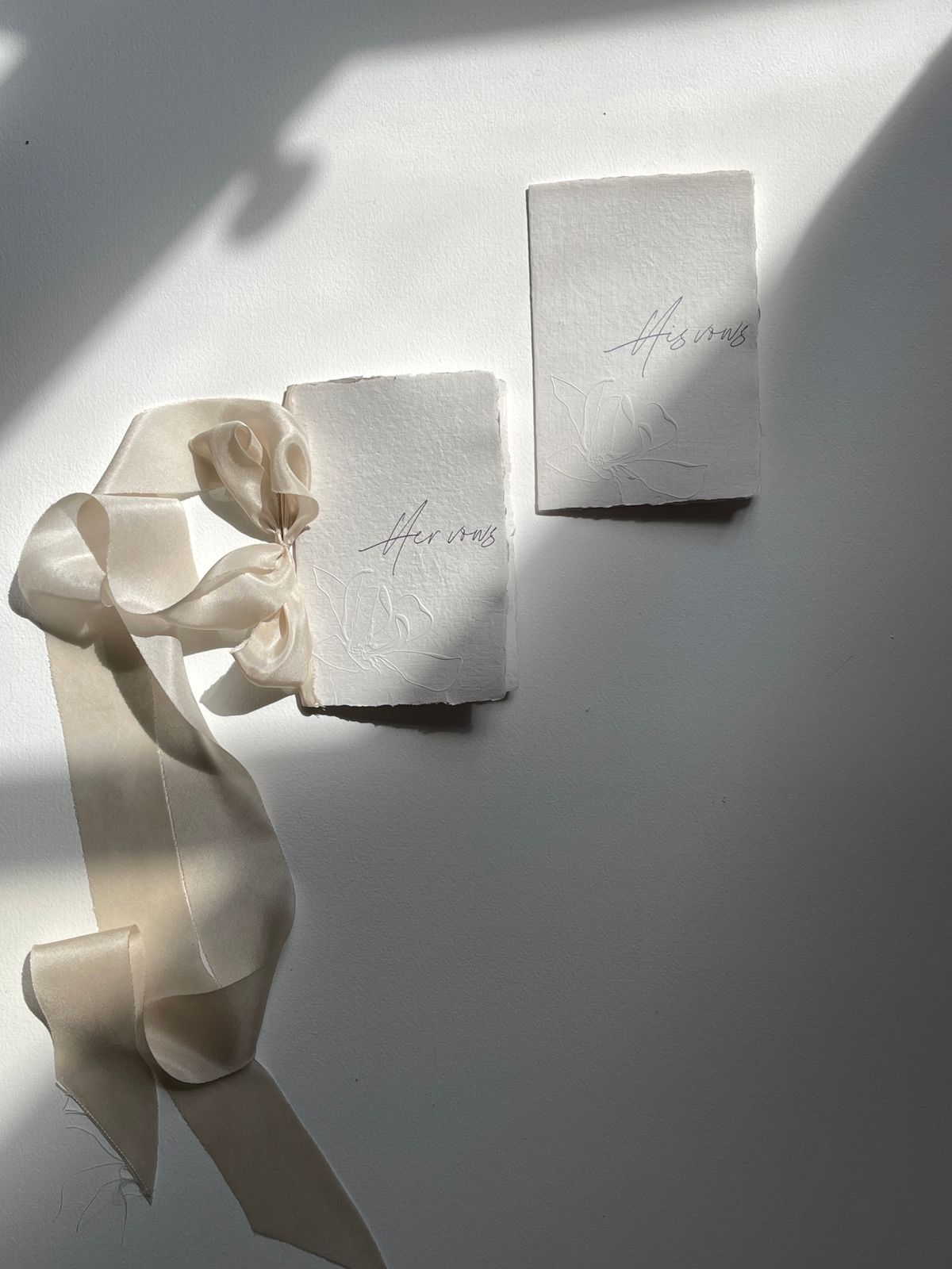 Small handmade booklets tied with ribbon