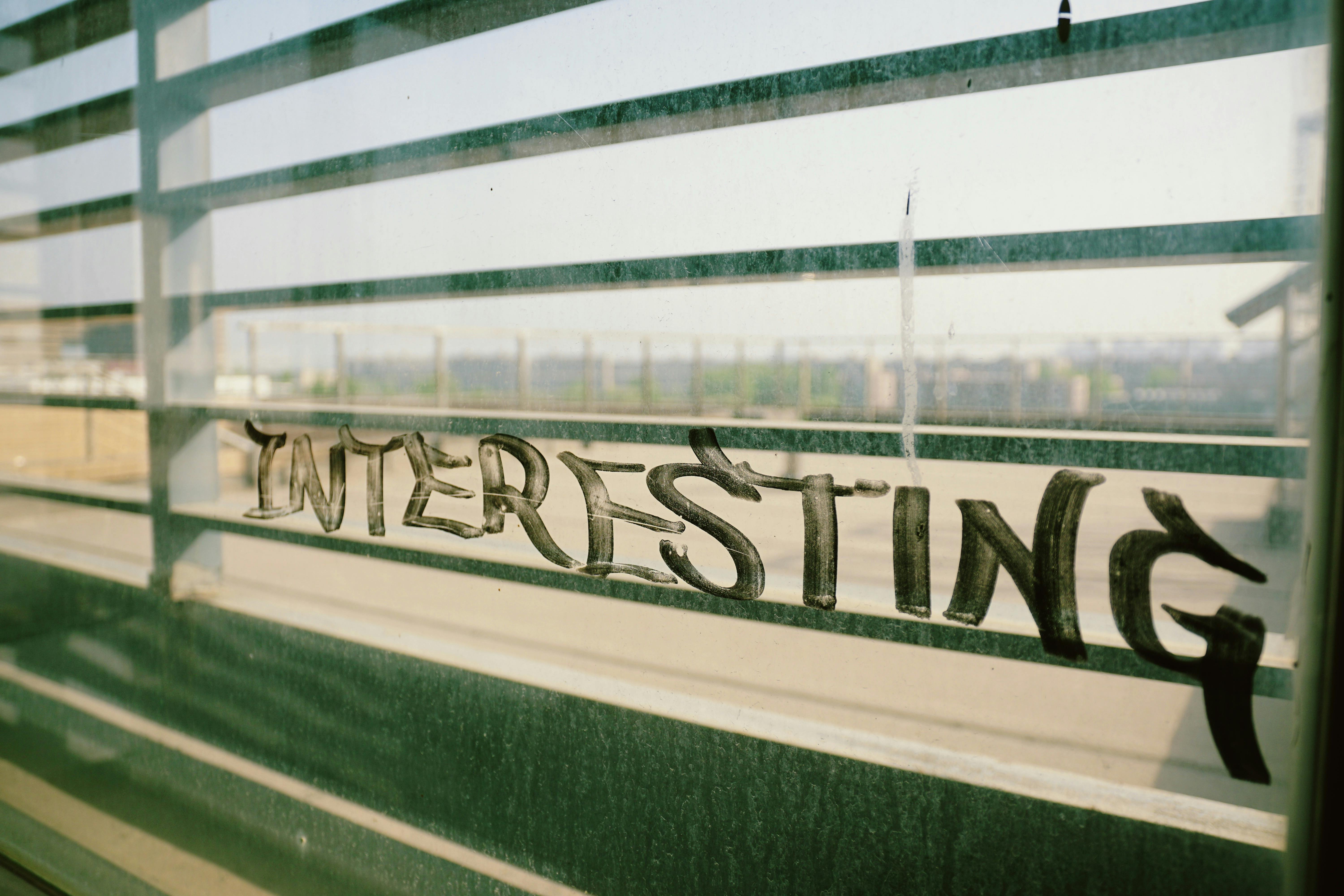 Urban graffiti on a window overlooking Xi An cityscape, capturing gritty textures and urban vibe.