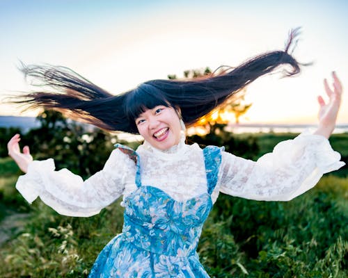 Smiling Woman with Long Hair Flying