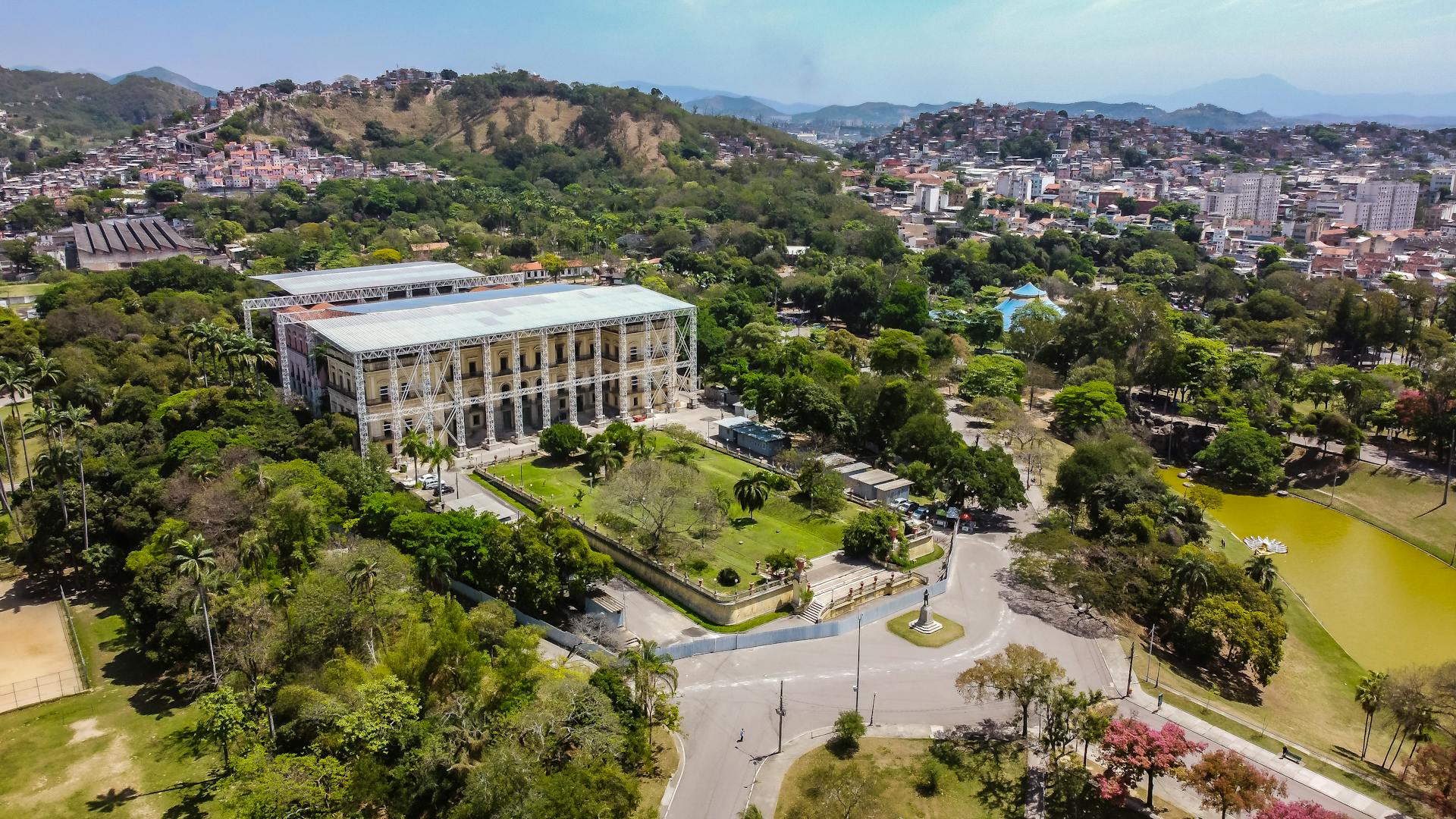 A stunning aerial view of the iconic Quinta da Boa Vista Park in Rio de Janeiro, showcasing lush greenery and historical architecture.