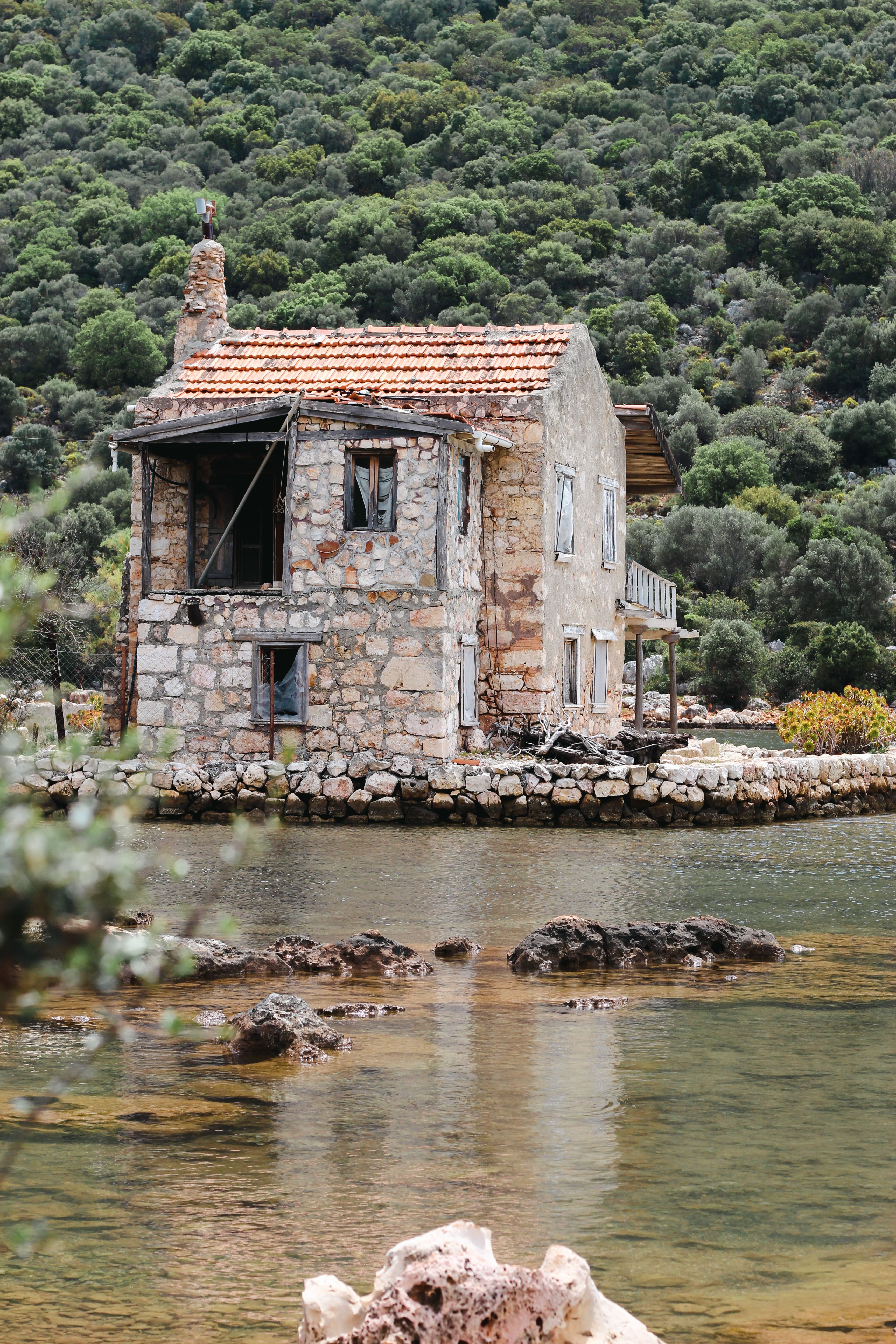 Abandoned Stone House by the River · Free Stock Photo