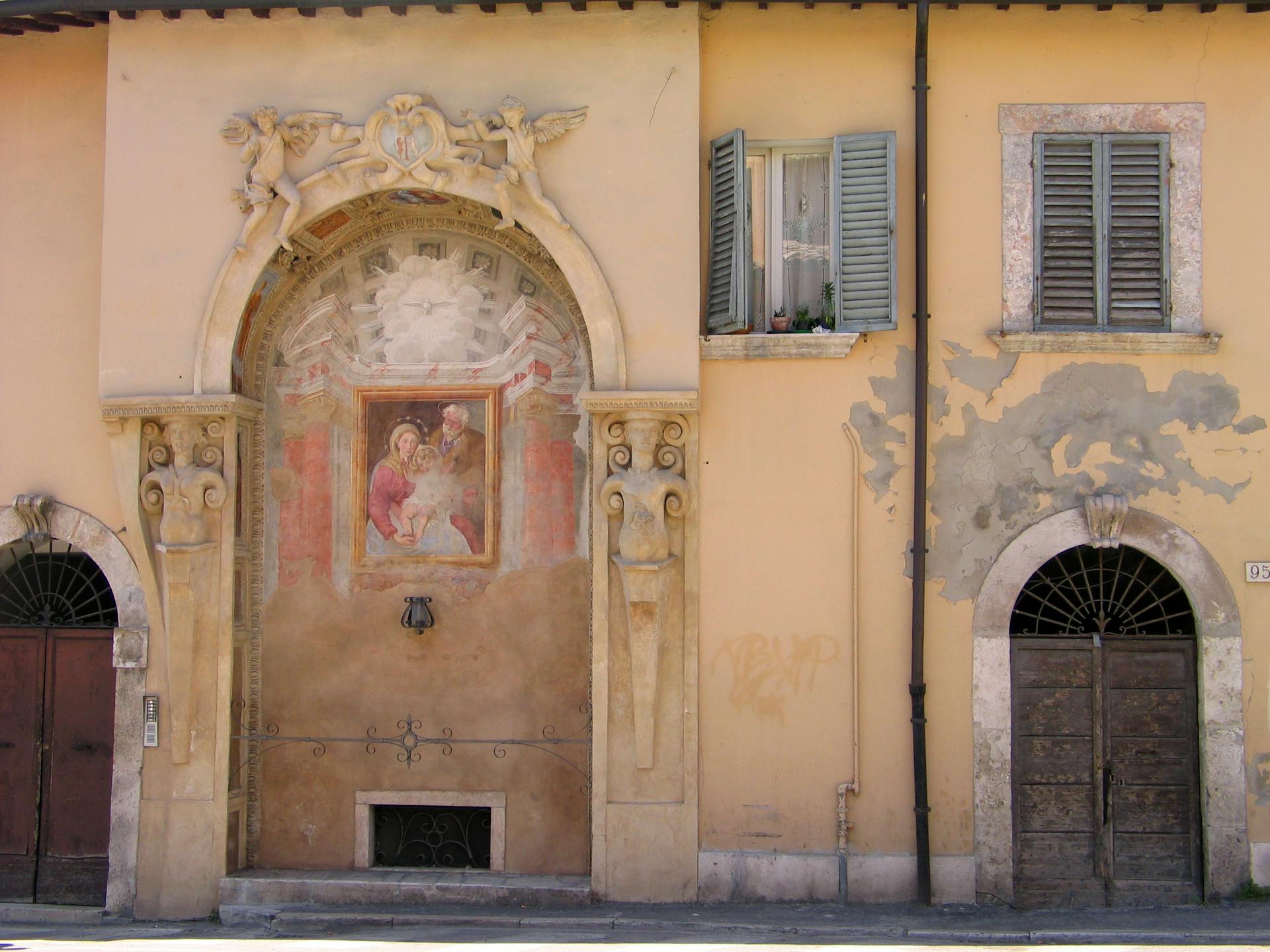 A building with a large painting on the side of it