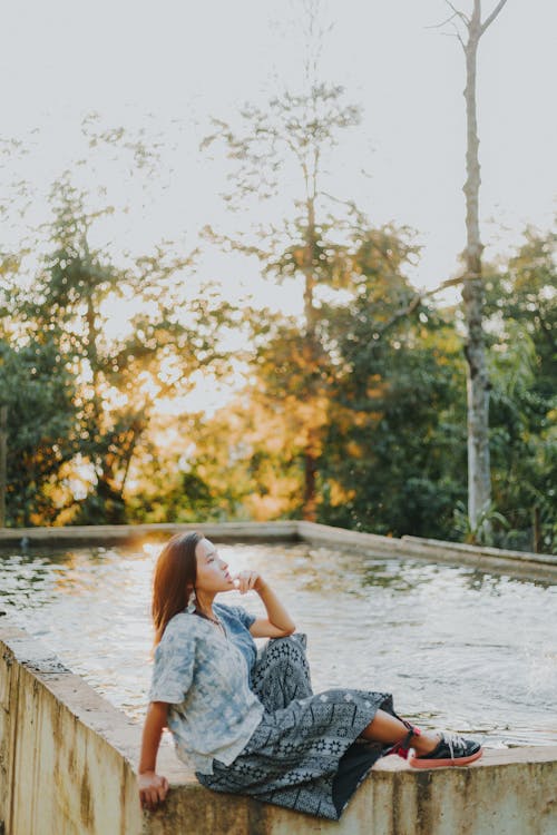 Model in Wide Pants by Swimming Pool