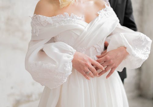 Elegant wedding embrace featuring bride and groom in İstanbul, showcasing love and modern bridal fashion.