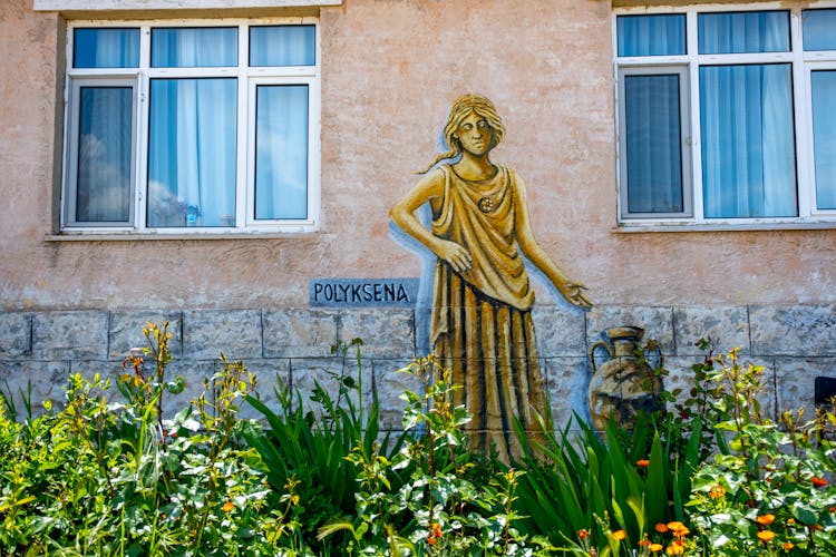 Mural Painting Of A Woman On The Building Facade 