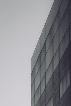 Minimalist geometric facade of a modern building in Bucharest, Romania.