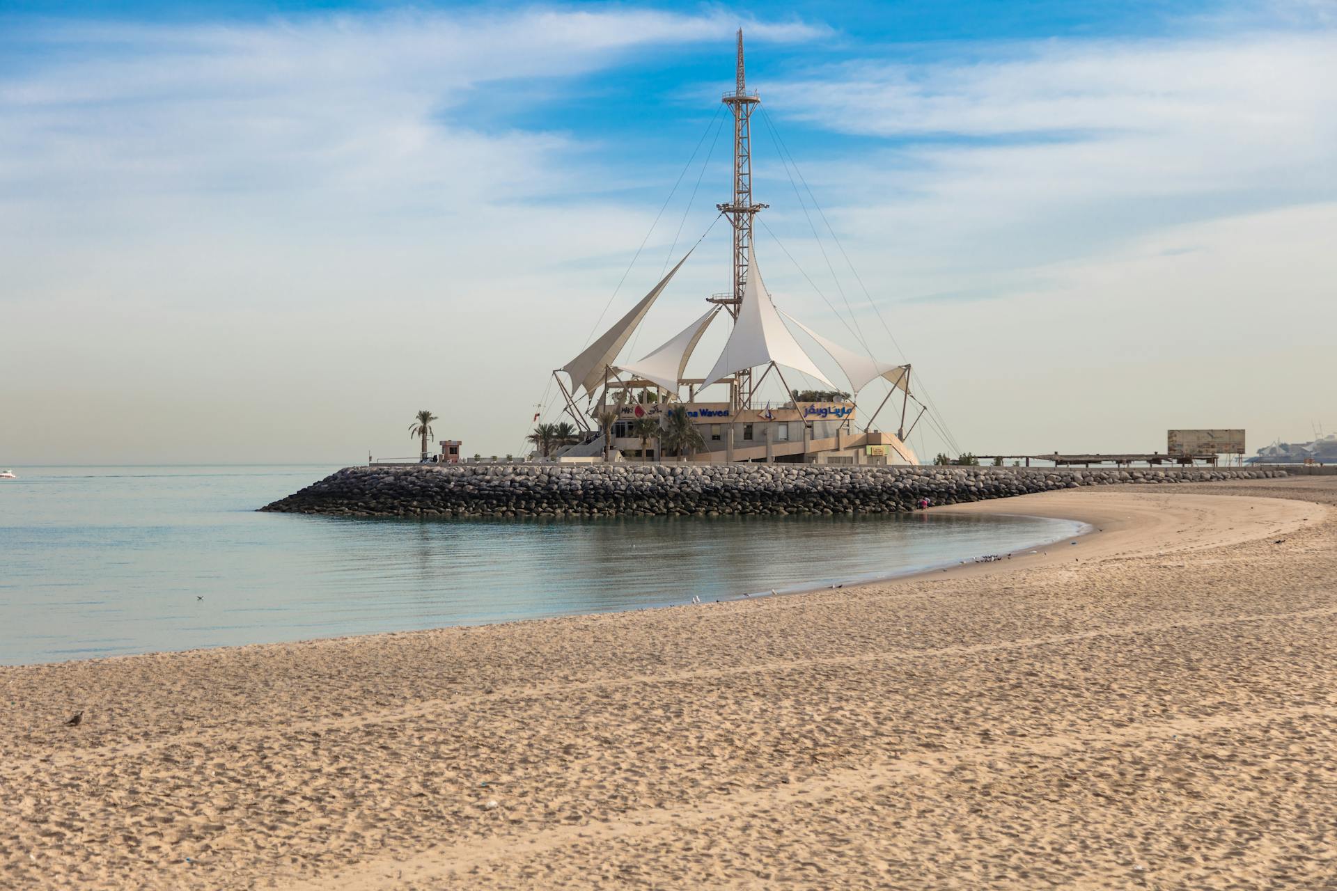 A distinctive sailing-themed restaurant on Marina Beach in Kuwait, perfect for travel and tourism visuals.
