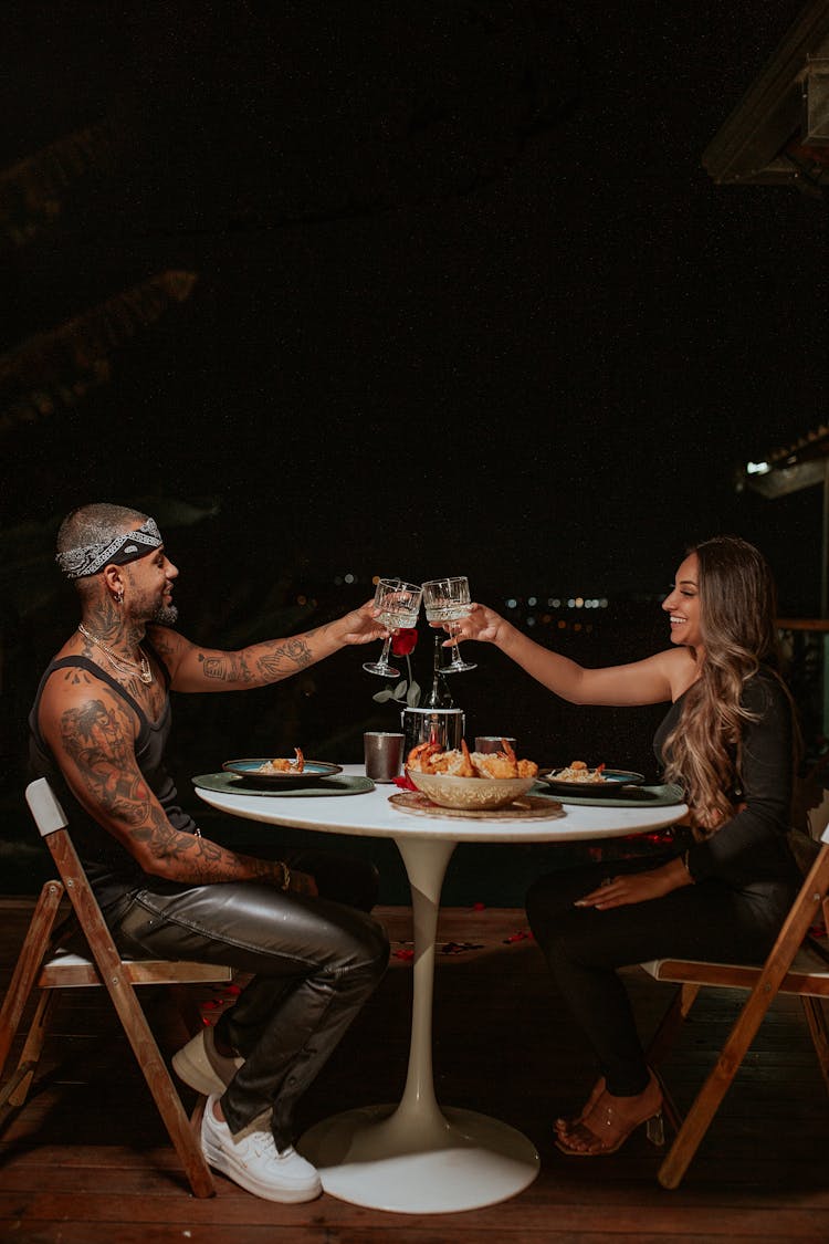 Couple Eating Supper In Restaurant