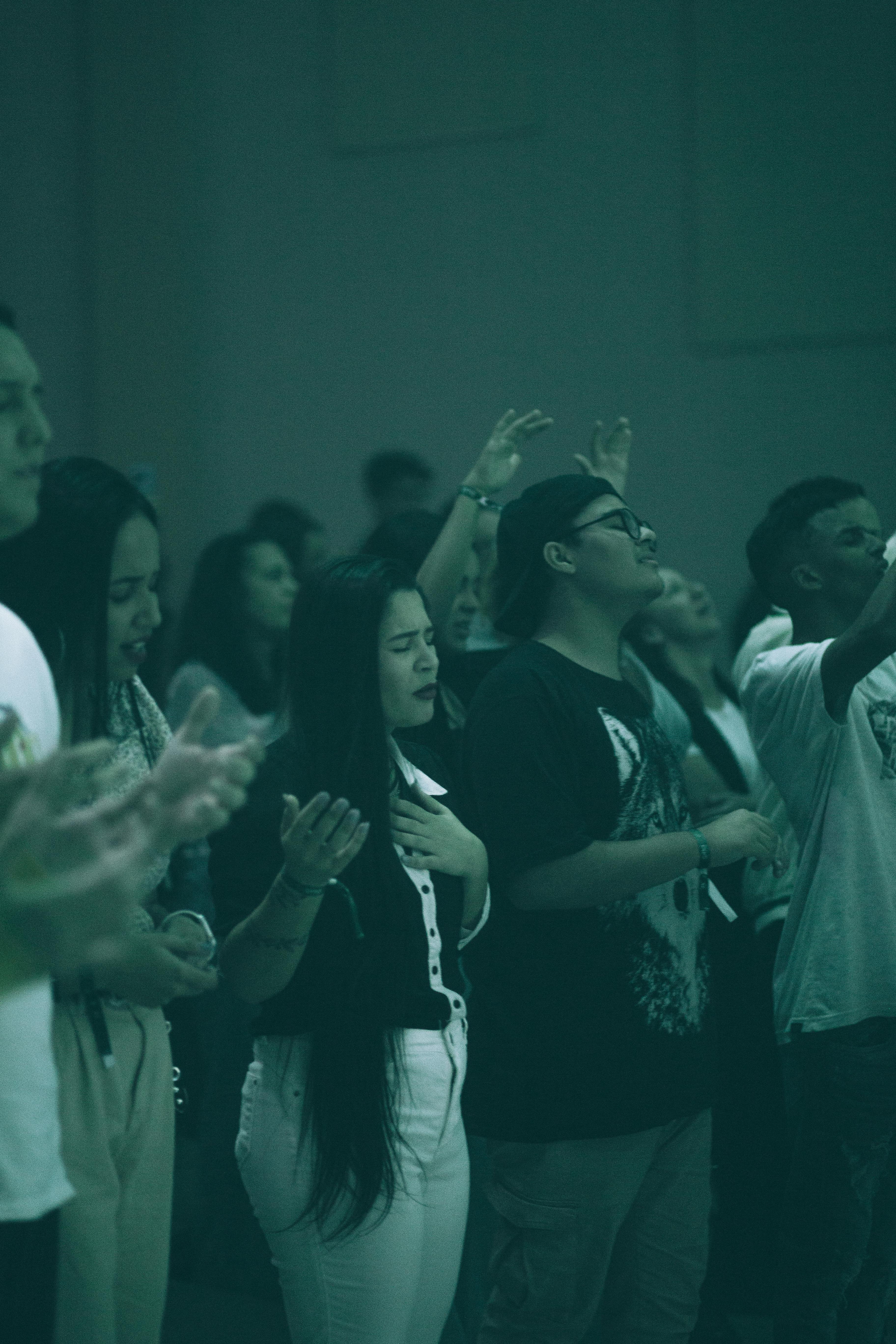 People in the Audience Singing with Eyes Closed · Free Stock Photo