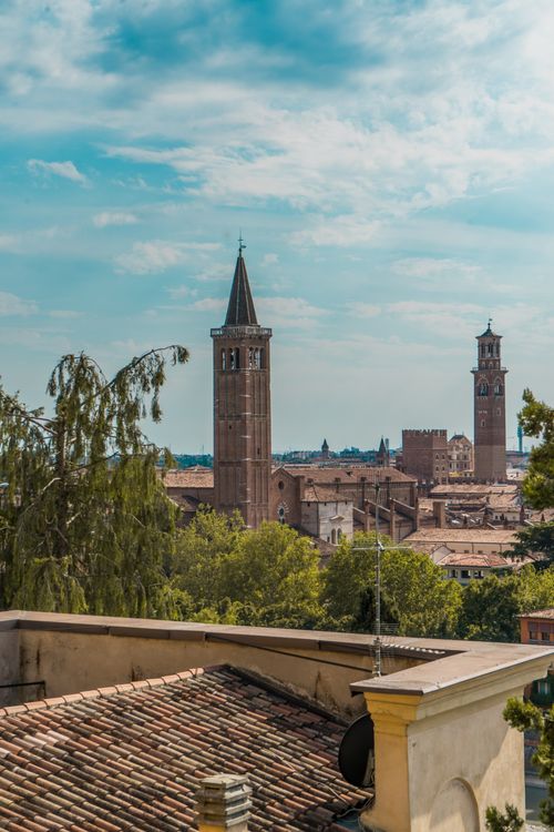 Free Scenic view of Verona cityscape showcasing prominent church towers and historic architecture. Stock Photo