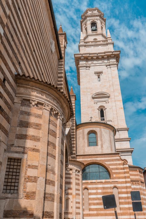 Free Capture of the iconic cathedral tower in Verona, showcasing its architectural splendor and historic charm. Stock Photo