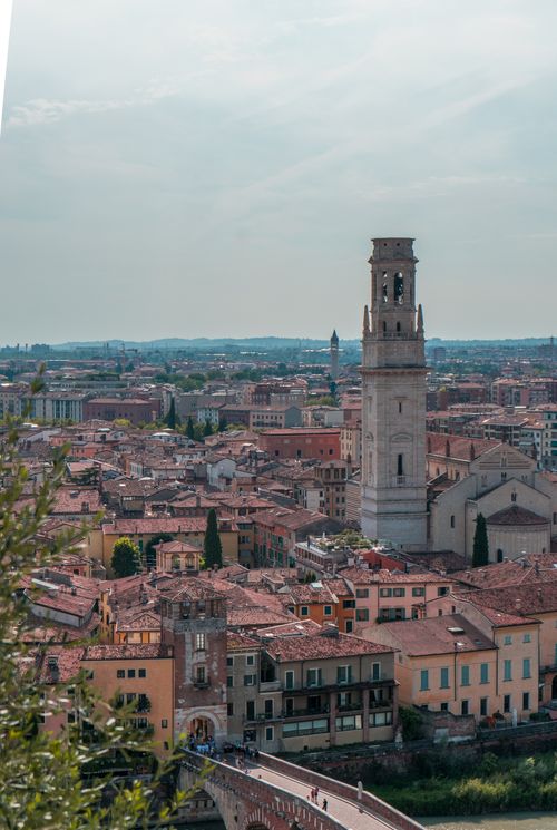 Free Scenic overhead view of Verona with historic architecture and iconic St. Anastasia Tower in Italy. Stock Photo