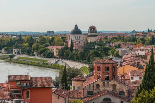 Explore Verona's stunning cityscape with historic architecture along the Adige River.