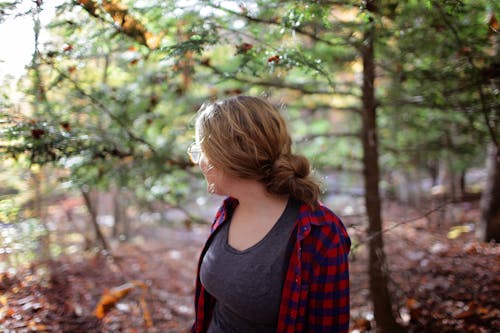 Free Woman Standing Beside Trees Stock Photo