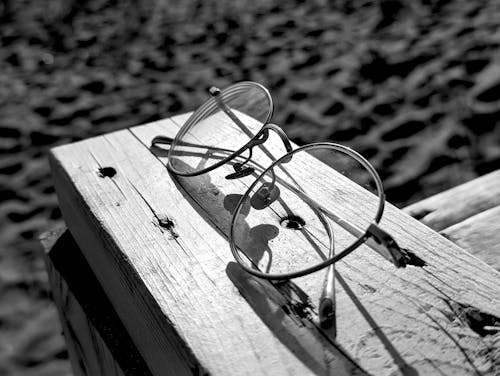 Eyeglasses on Sunlit Plank in Black and White