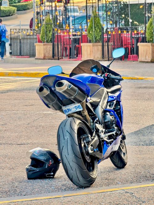 Free A striking blue motorcycle parked outdoors on a city street in Halifax, NS, Canada. Stock Photo