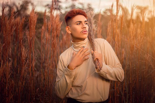 Man Posing Among Wheat in Sunlight 