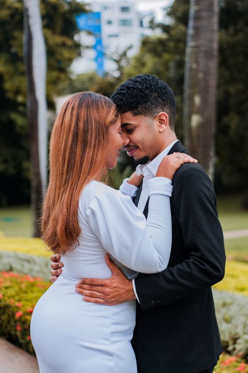 Free A romantic wedding portrait of a couple embracing in a lush park setting in Santo Domingo. Stock Photo