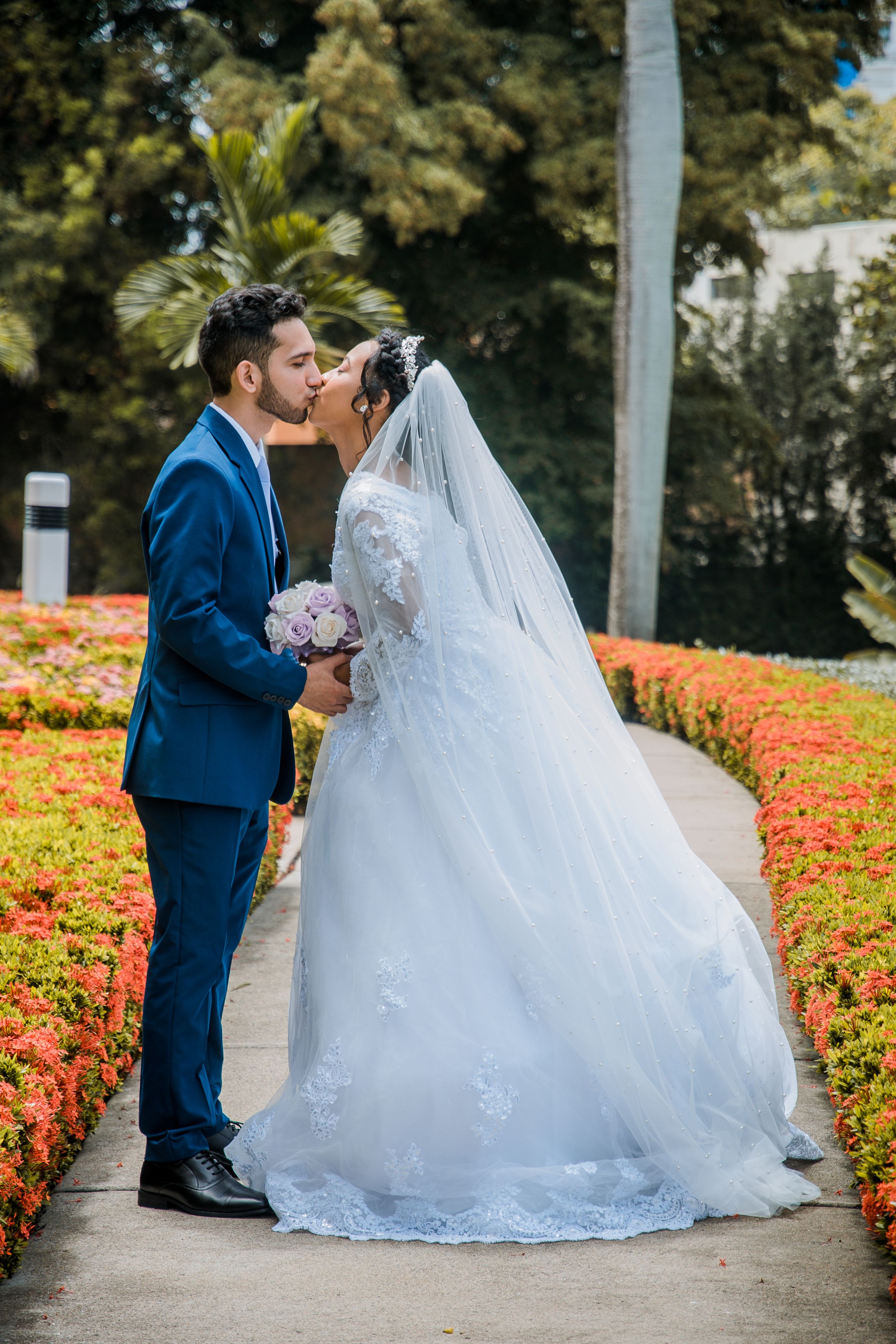 Wedding Couple Kissing in a Park · Free Stock Photo