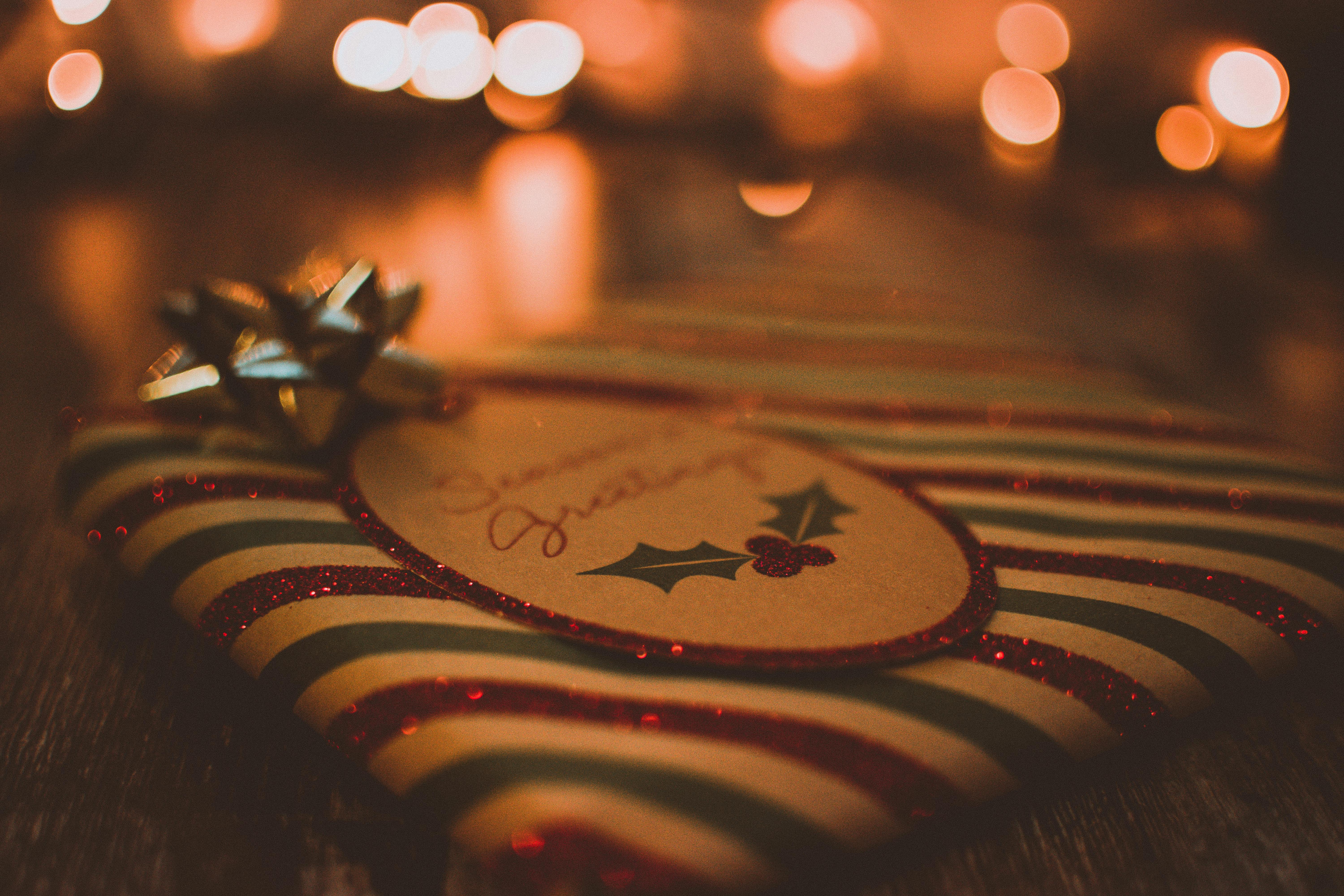 square red green and white striped gift box with lights