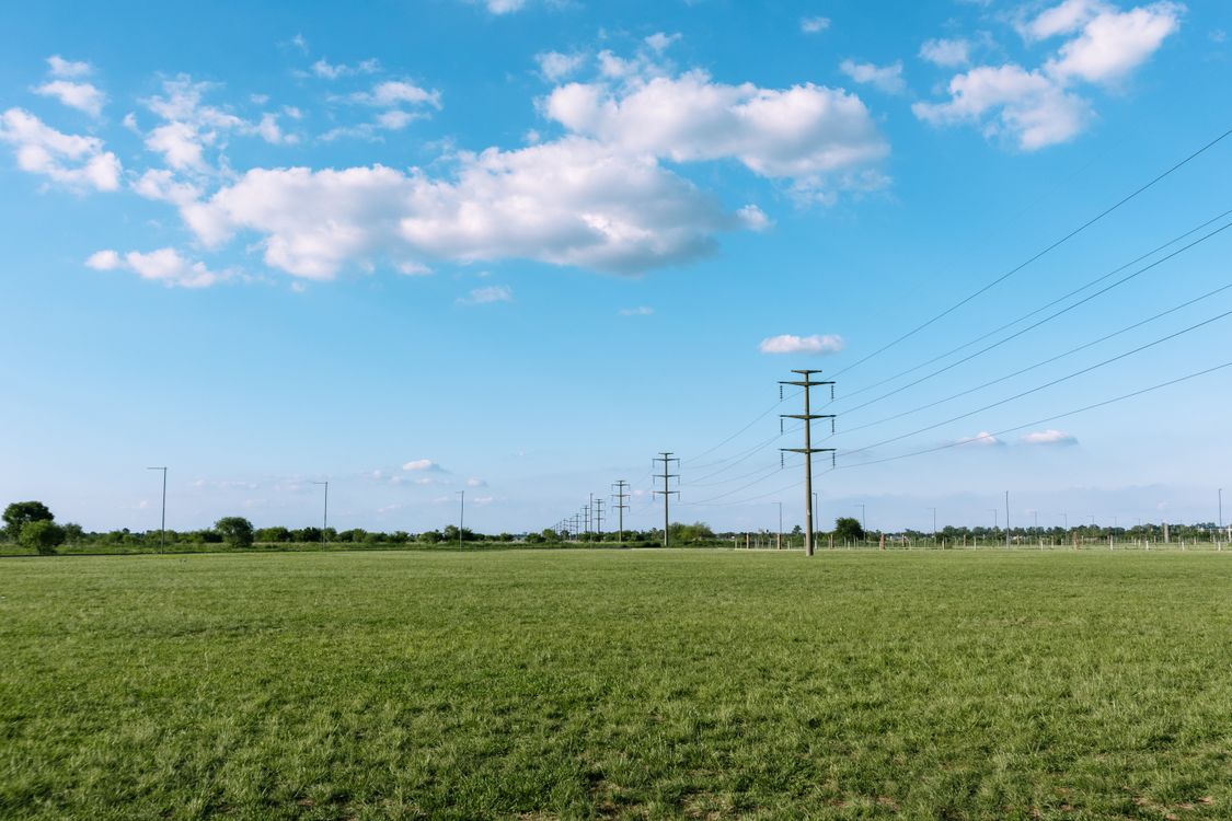 Utility Field Ground Utility Poles on Rural Field · Free Stock Photo