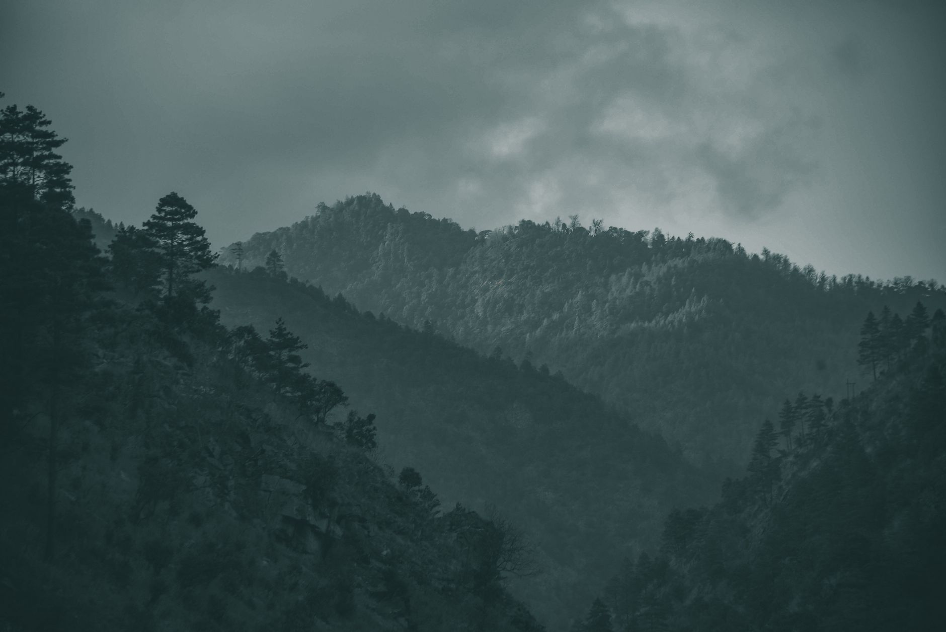 A breathtaking view of mountains and clouds in Kalaktang Village.