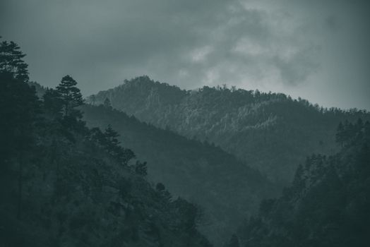 A breathtaking view of mountains and clouds in Kalaktang Village.