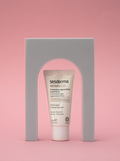 Free Sun Cream in a Pink Studio  Stock Photo